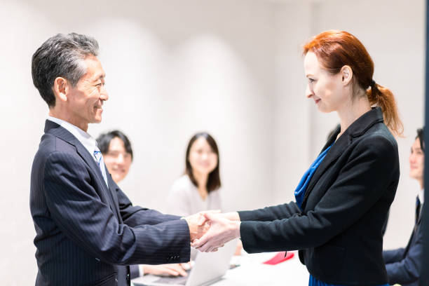 istock Business people signing a contract 1385392562