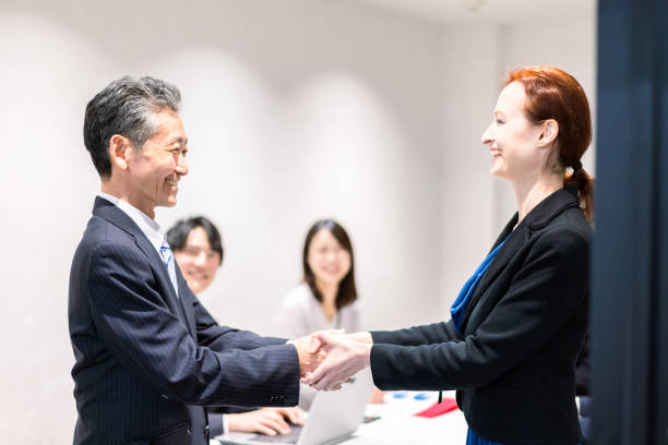 istock Business people signing a contract 1385392568