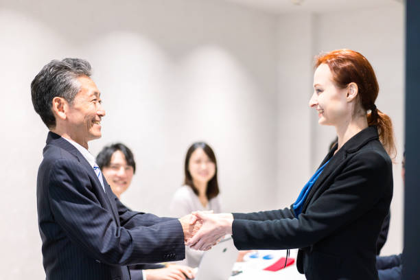 istock Business people signing a contract 1385392586