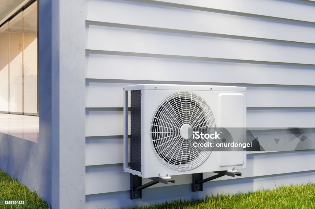 Air Conditioning Unit On Building Facade Heat - Temperature Stock Photo