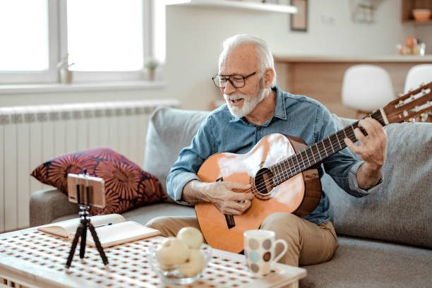 istock Senior man shooting music video 1385394650