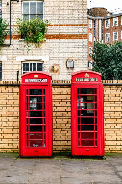 Victorian apartments behind the iconic British telephone booth in London