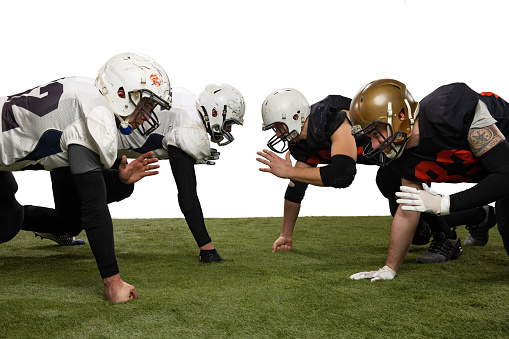 Two Junior Football players during practice game at the outdoor field.