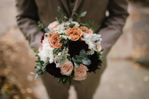 istock Gay wedding. Equality LGBT concept. Man with wedding bouqet. 1385398037