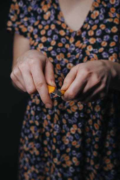 istock girl sharpens a pencil to draw 1385401637
