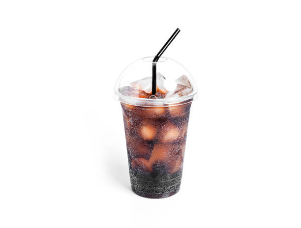 istock Soda with ice in a transparent plastic glass isolated on a white background 1385403797