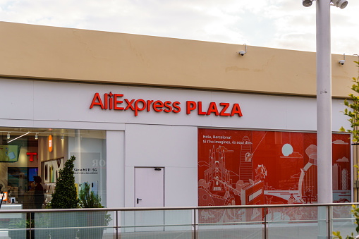 Barcelona, Spain - February 28, 2022. Logo and façade of ALIEXPRESS PLAZA, in Barcelona, Spain, physical store of the Chinese store.