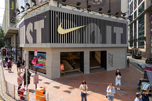Hong Kong - March 15, 2022 : People walk past the Nike Running Store at Causeway Bay in Hong Kong.