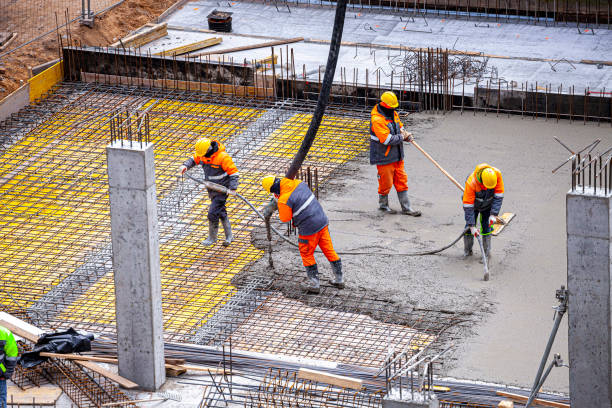 Concrete pouring on the construction site. stock photo