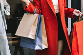 Women's hands hold many shopping bags, Sale season