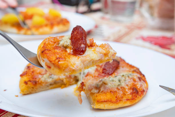 Cabrales cheese and Chorizo mini pizza in close range, yummy heavy food... the kind you enjoy all day long...