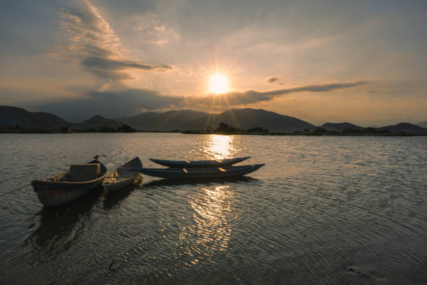istock Fishing boat in sunset 1385408449