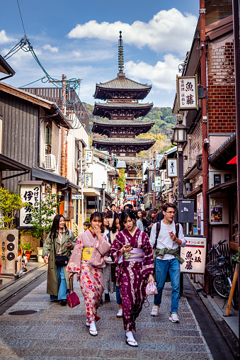 march 29, 2019 - Kyoto, Japan: tourists in typical dress in front of Hōkan-ji Temple with Yasaka Pagoda, Kyoto, Japan. Tourists wander down the narrow streets of the Higashiyama District neighbourhood in Kyoto, Japan