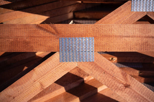 Stack of wooden squared beams for construction. Material for the construction of a wooden building. Closeup big wooden boards