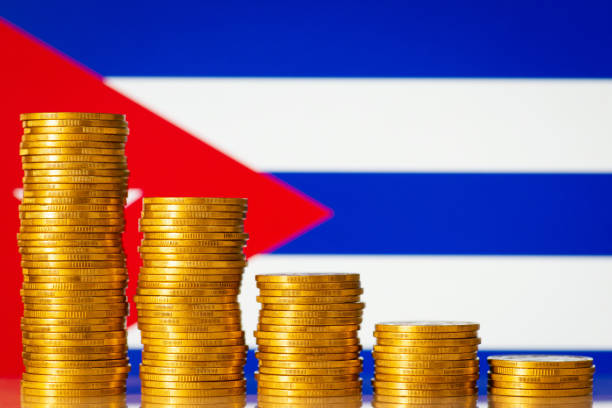istock Golden coins in front of Cuba flag 1385409500