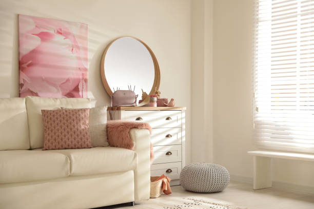 istock Trendy round mirror in modern room interior 1385413884