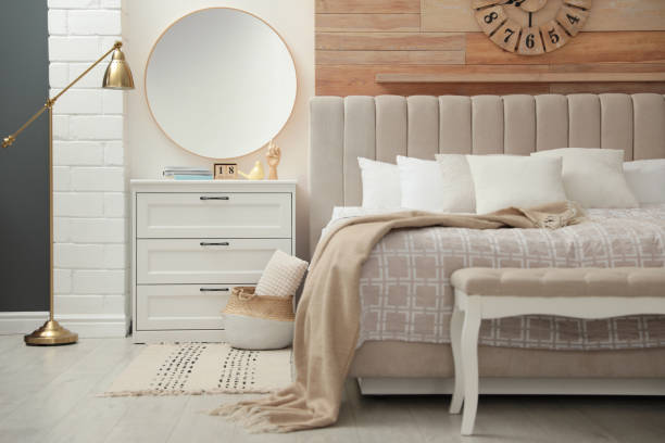 istock Trendy round mirror in modern bedroom interior 1385415296