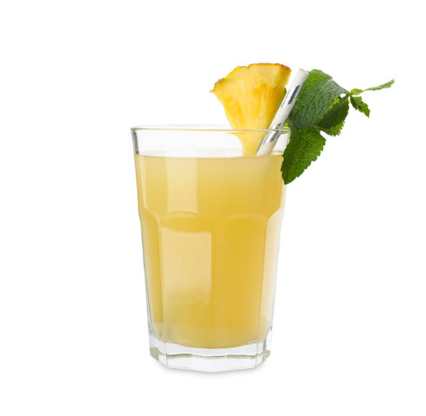 istock Delicious fresh pineapple juice with mint isolated on white 1385417445
