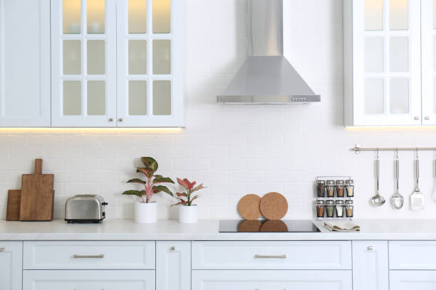 istock Modern toaster and household appliances on counter in kitchen 1385417773