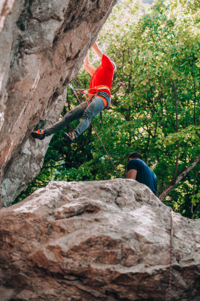 istock Rock climber on a face of a cliff face 1385418424
