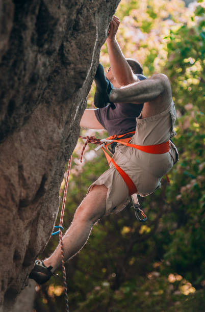 istock Rock climbing on a sunny summer day 1385418426