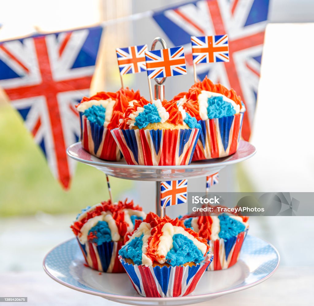 Royal Jubilee Cupcakes for Platinum Jubilee Celebrations Red White and Blue, British Royal Jubilee Cupcakes, to celebrate the Queen's Platinum Jubilee. Designed in the shape of the Union Jack Flag, to represent Great Britain's monarchy in preparation for the Platinum Lunch and street parties that will be happening around the Uk in June. Platinum Jubilee Stock Photo