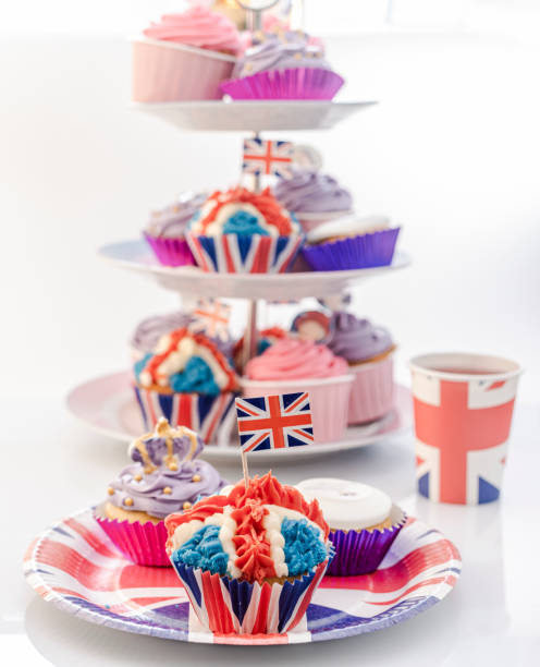 Royal Jubilee Cupcakes for Platinum Jubilee Celebrations Red White and Blue, British Royal Jubilee Cupcakes, to celebrate the Queen's Platinum Jubilee. Designed in the shape of the Union Jack Flag, to represent Great Britain's monarchy in preparation for the Platinum Lunch and street parties that will be happening around the Uk in June. decorating a cake photos stock pictures, royalty-free photos & images