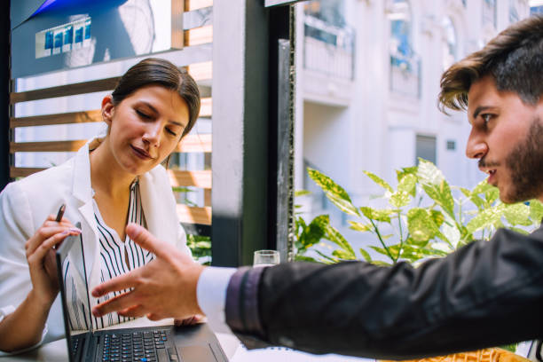 istock Young couple of professionals chatting during a coffee break 1385421111