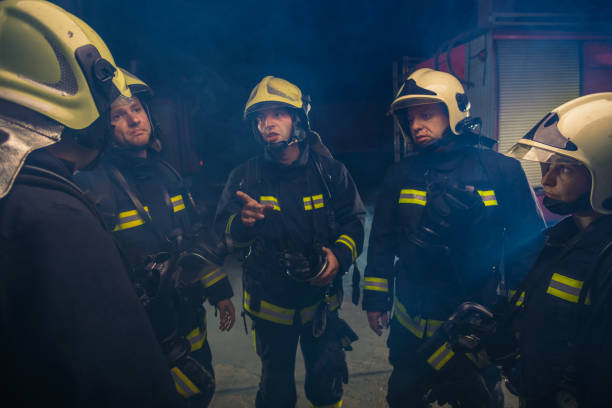 istock Group of firemen in the fire department organizing action plan for safe execution 1385429739