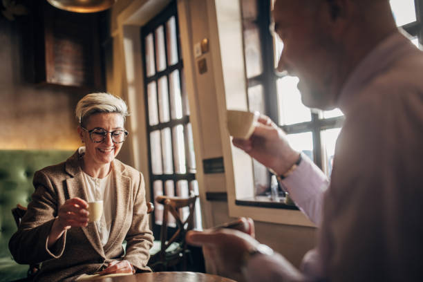 istock Man and woman in cafe 1385433576