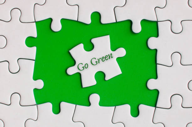 istock Go green text on jigsaw puzzle. Nature Concept 1385433701