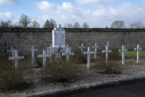 Dijon, France - February 21 , 2022: Les Pejocus Cemetery in Dijon contains Belgium, French, Russian, Italian, Commonwealth and German graves.  Sunny winter day. Selective focus