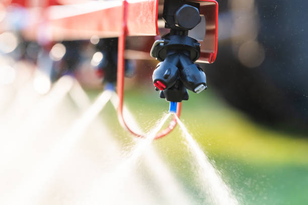 Nozzle of the tractor sprinklers Nozzle of the tractor sprinklers sprayed. apply fertilizer stock pictures, royalty-free photos & images