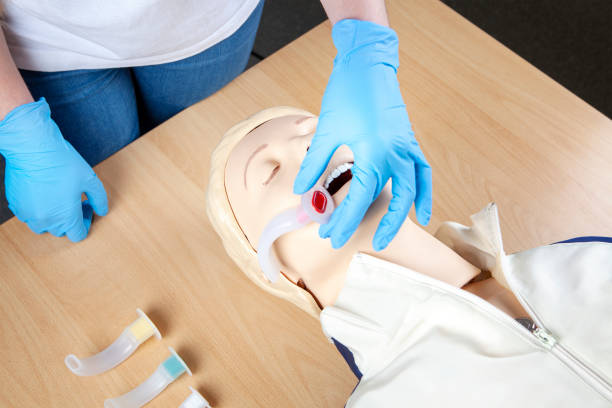istock First Aid. Preparing an oropharyngeal airway for Bag-Valve-Mask (BVM) Ventilation. 1385442421