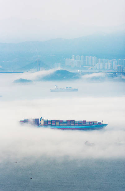 Aerial view of cargo ship in fog