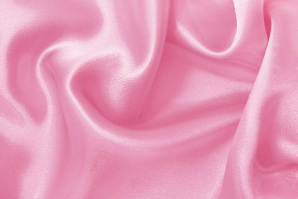 istock Pink fabric cloth texture for background and design art work, beautiful crumpled pattern of silk or linen. 1385446391