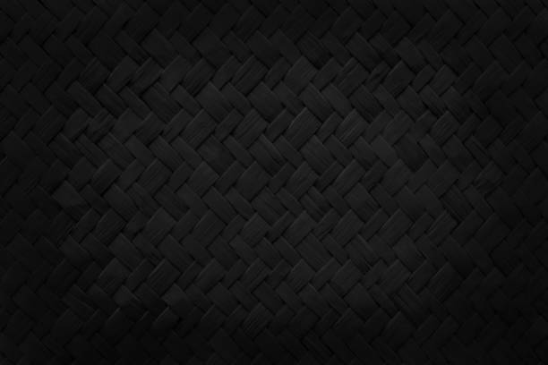 istock Pattern of black weave reed mat with vintage style for background and design art work. 1385446418