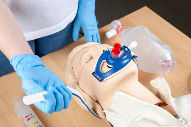 istock First Aid. Preparing a laryngeal tube for Bag-Valve-Mask (BVM) Ventilation. 1385449883