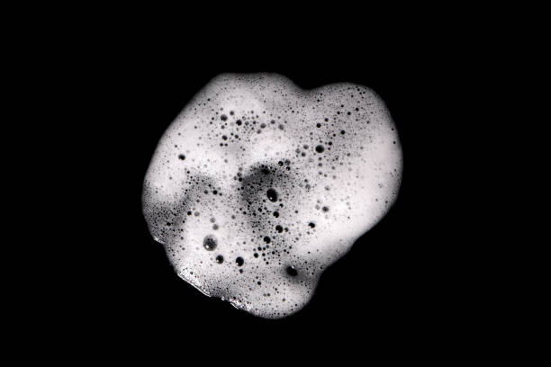istock Top view, liquid white foam from soap or shampoo or shower gel 1385451604