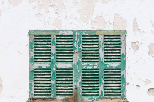 istock white wall with a colorful wooden shutters 1385455691