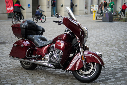 Strasbourg - France - 12 March 2022 - Profile view of red Indian motorbike parked in the street