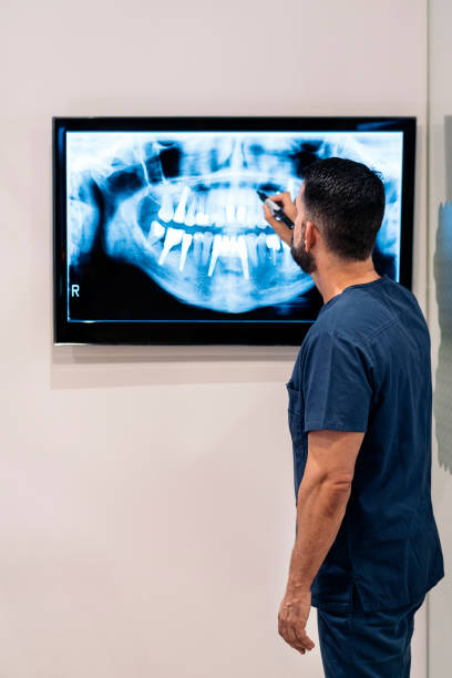istock Dental Clinic Worker With X-ray 1385461370