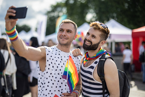 Gay couple making selfie at the pride parade