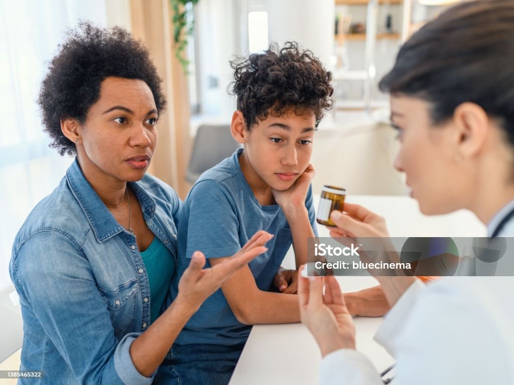 Doctor gives patient prescription medication Shot of a doctor having a consultation with a patient Antibiotic Stock Photo