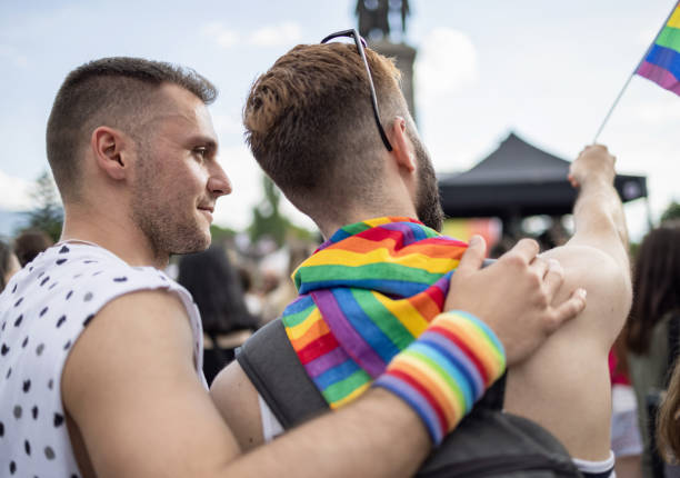 istock Men at the LGBTQ pride parade 1385471635