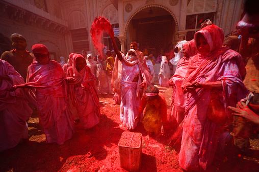 Indian Widows covered with colored powder and flower petals are seen dancing as they take part in a celebration of Holi or 'festival of colors' at Gopinath Temple in Vrindavan, India.

Indian widows, seen breaking all social barriers, celebrate the festival of colors which are missing in their life as windows in Indian tradition are considered social outcasts. This event was organized by the non-government social organization, Sulabh International, which has taken up countrywide welfare initiatives for the unprivileged widows and betterment of their last part of life