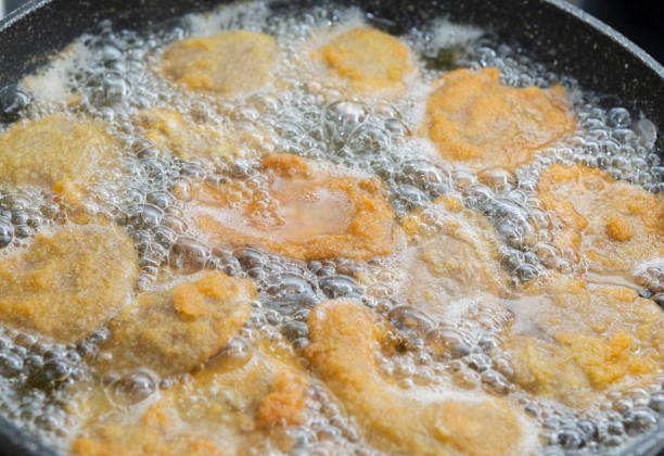 Pleurotus ostreatus breaded in the kitchen, with egg and bread ready to be fried