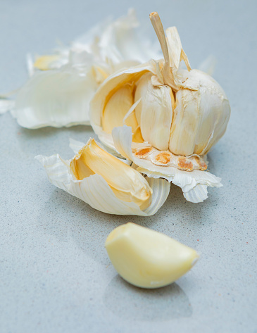 Garlic in a modern silestone kitchen's surface. white garlic from Spain.