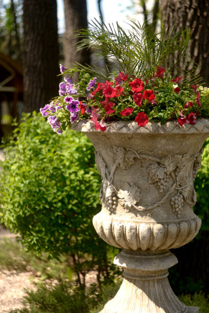 istock flower pot in garden . 1385480436