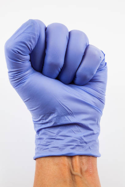 istock Hand with medical glove 1385481895